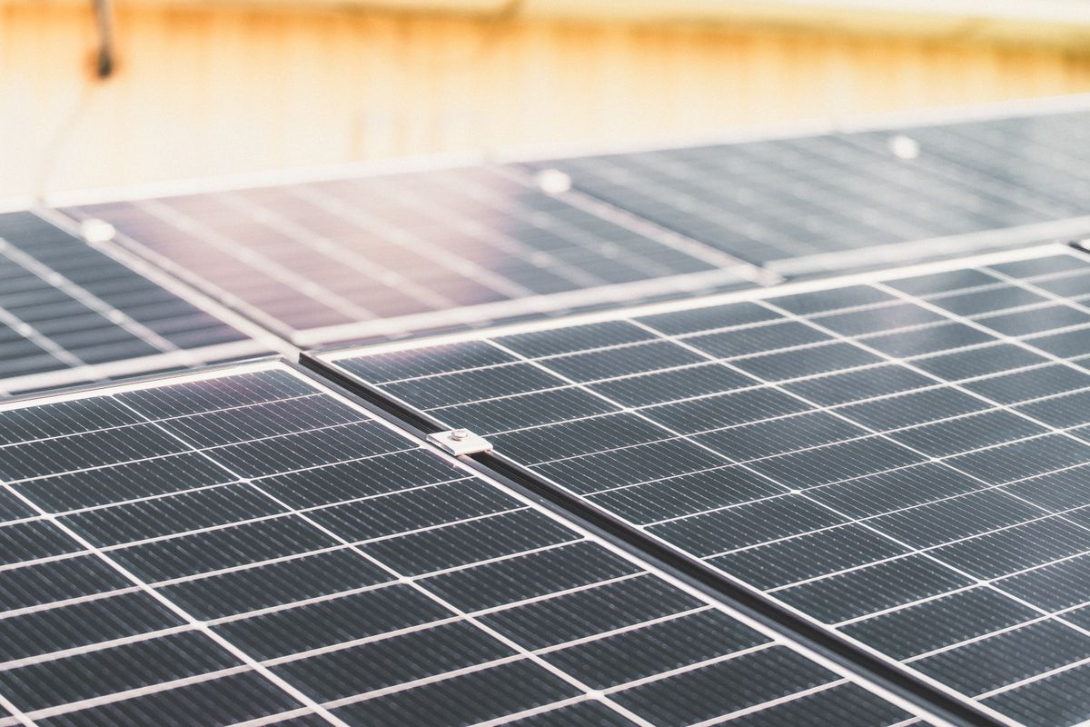 Close view of a rooftop solar array and its mounting rails