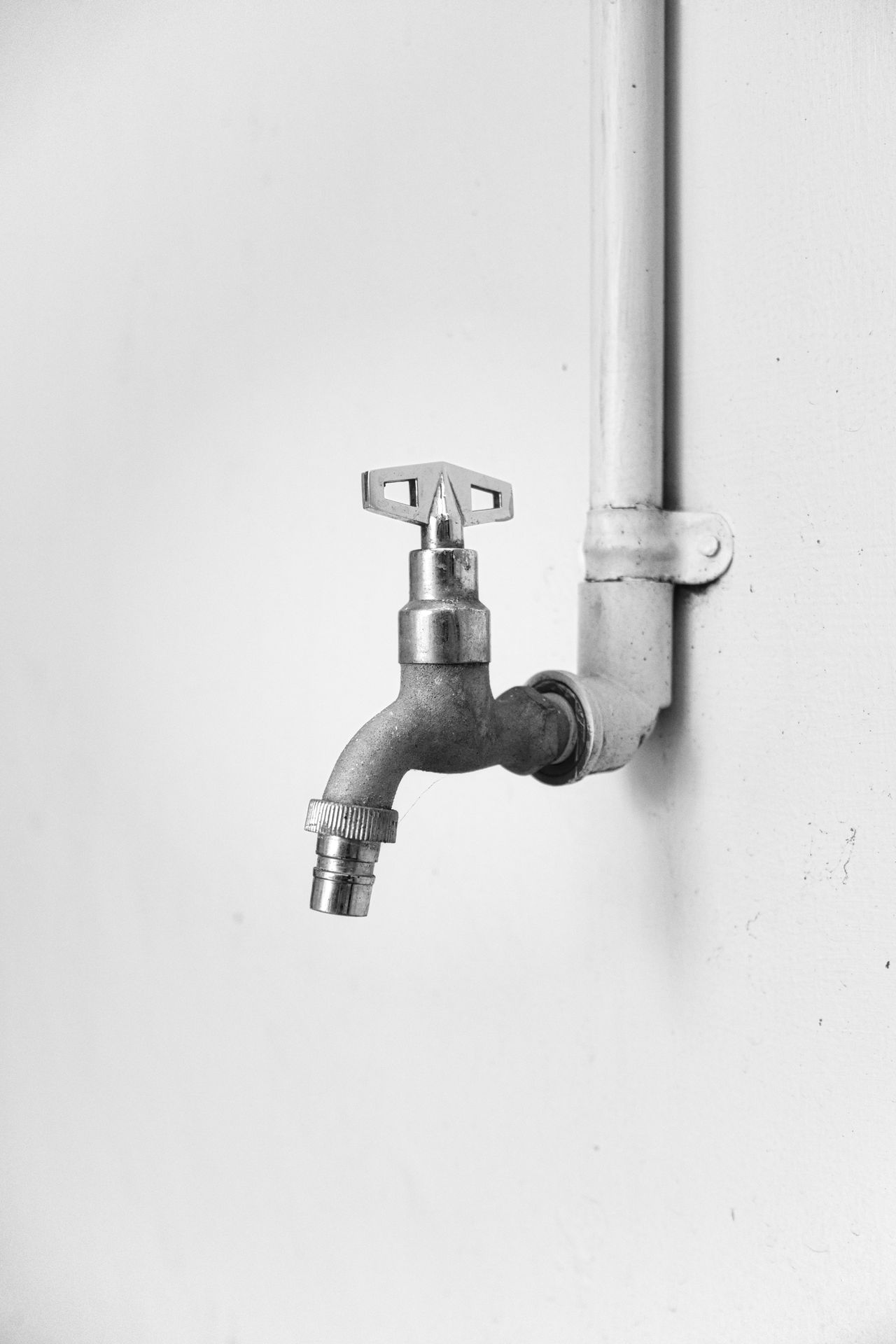 New outside tap installed against a white wall