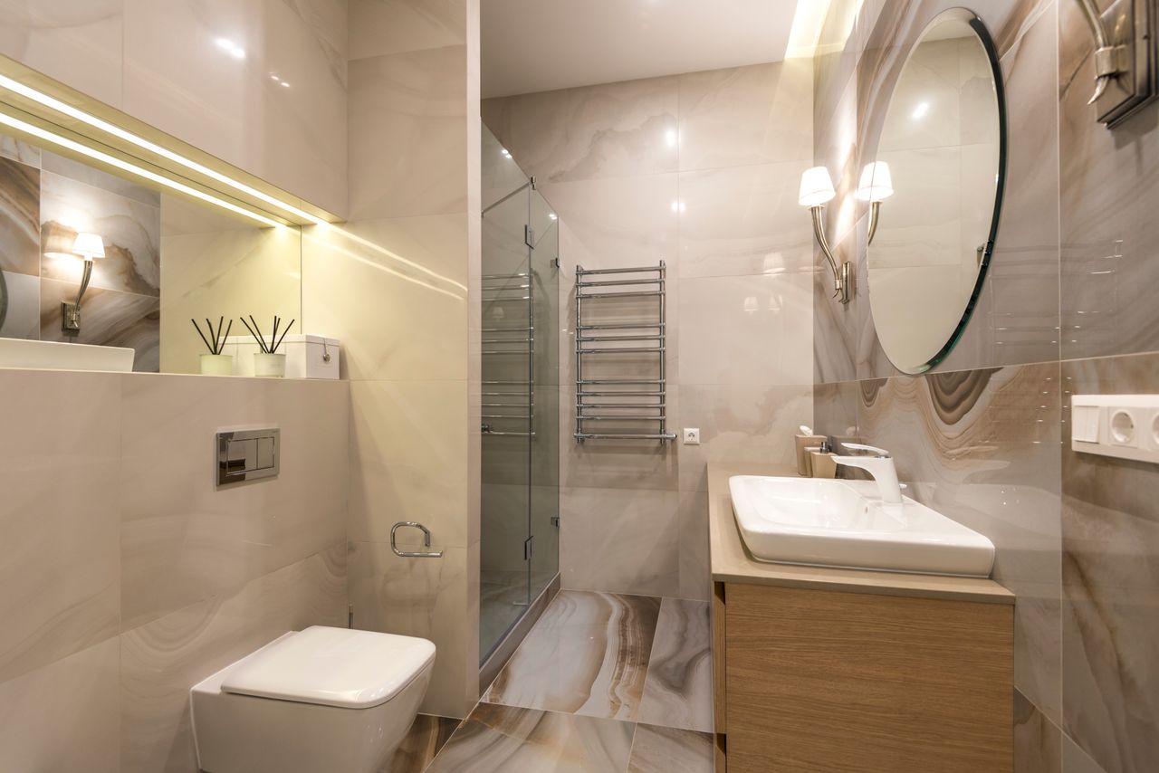 Marble bathroom with glass shower and double vanity