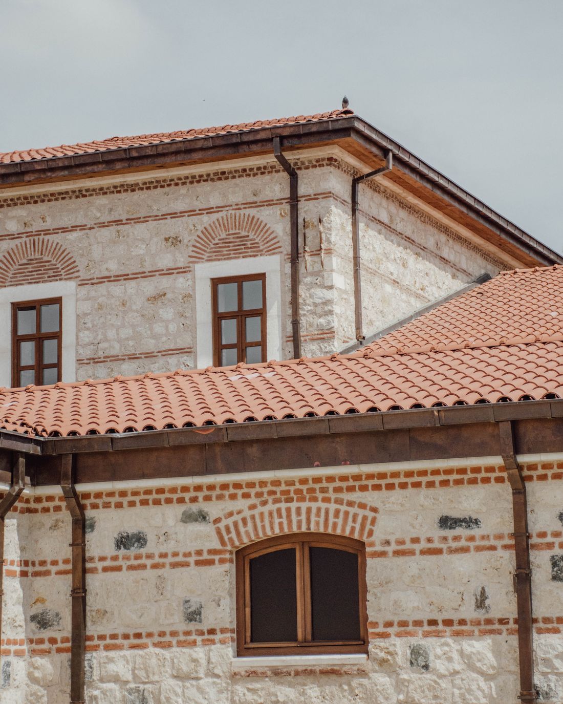 A building exterior with a terracotta tiled roof